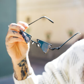 close-up-man-s-hand-holding-sunglasses-hand-summer